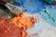 Paint Brush on Smudges of Assorted Colors of Paint