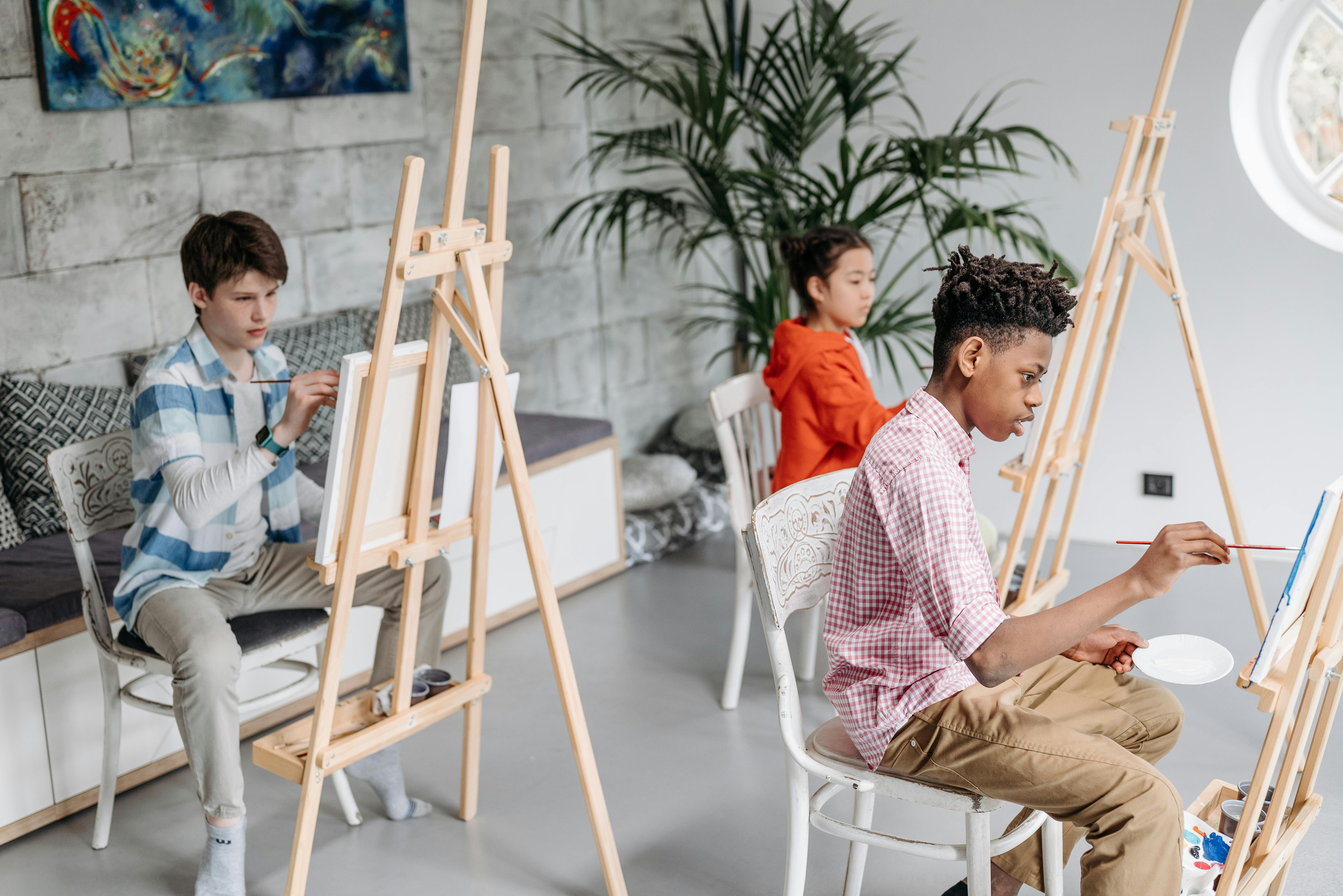 Students Painting on Canvas during an Art Class · Free Stock Photo