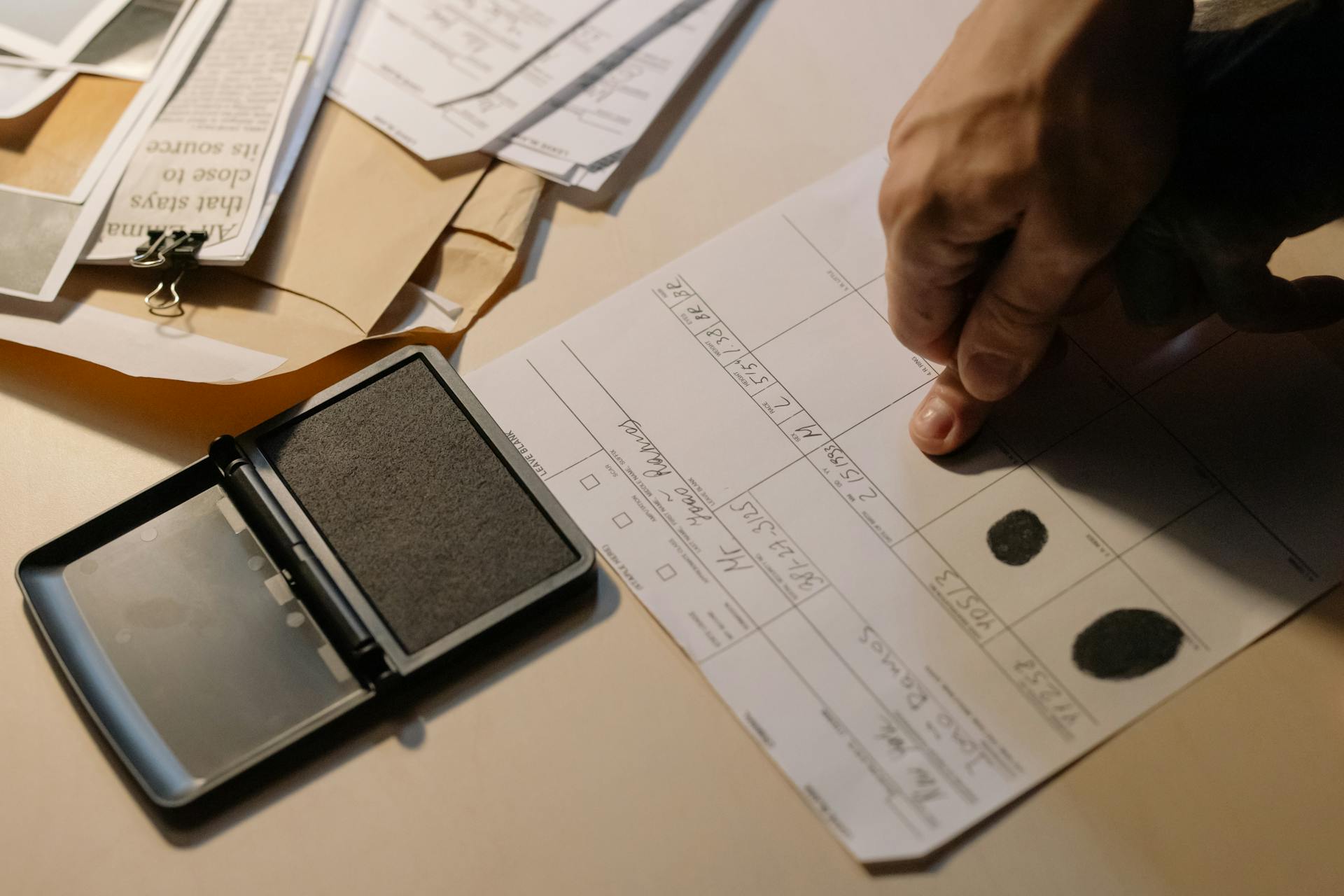 Close-up Photo of Putting of Fingerprint on Paper