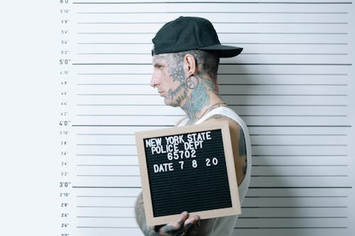 Free Close-Up Shot of a Tattooed Man in White Tank Top Stock Photo
