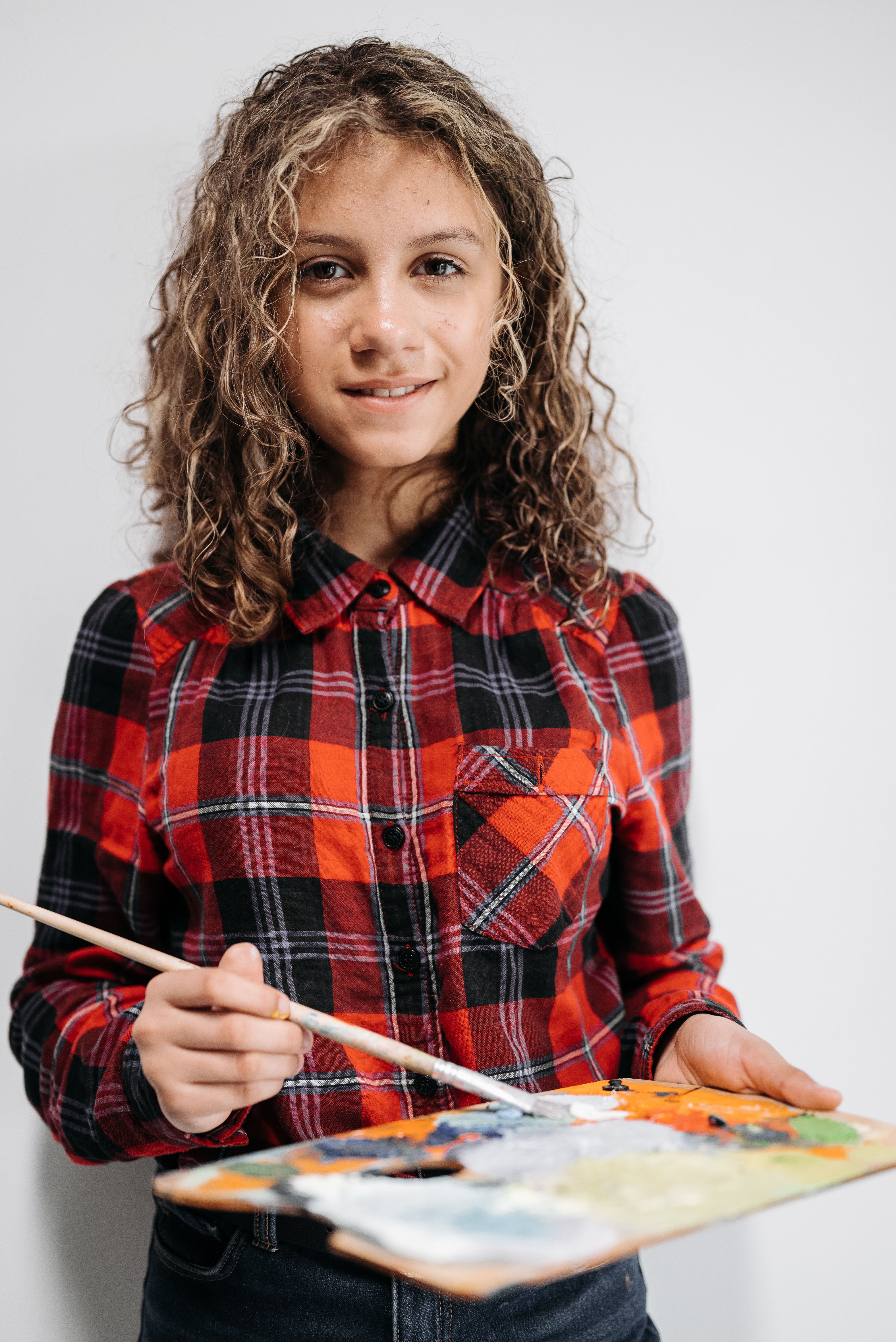 A Beautiful Girl Holding a Paintbrush and a Color Palette · Free Stock ...