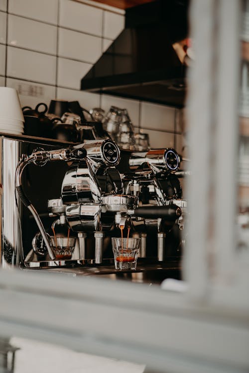 A Stainless Steel Espresso Machine Brewing Coffee