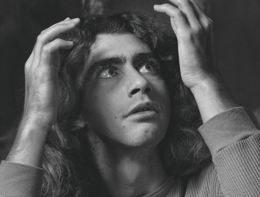 A captivating black and white portrait showcasing dramatic emotion and expression.