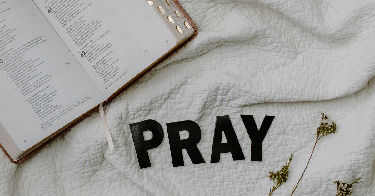 Open Bible and quiet prayer setting for a VineyardMaker reflection on dry prayer.