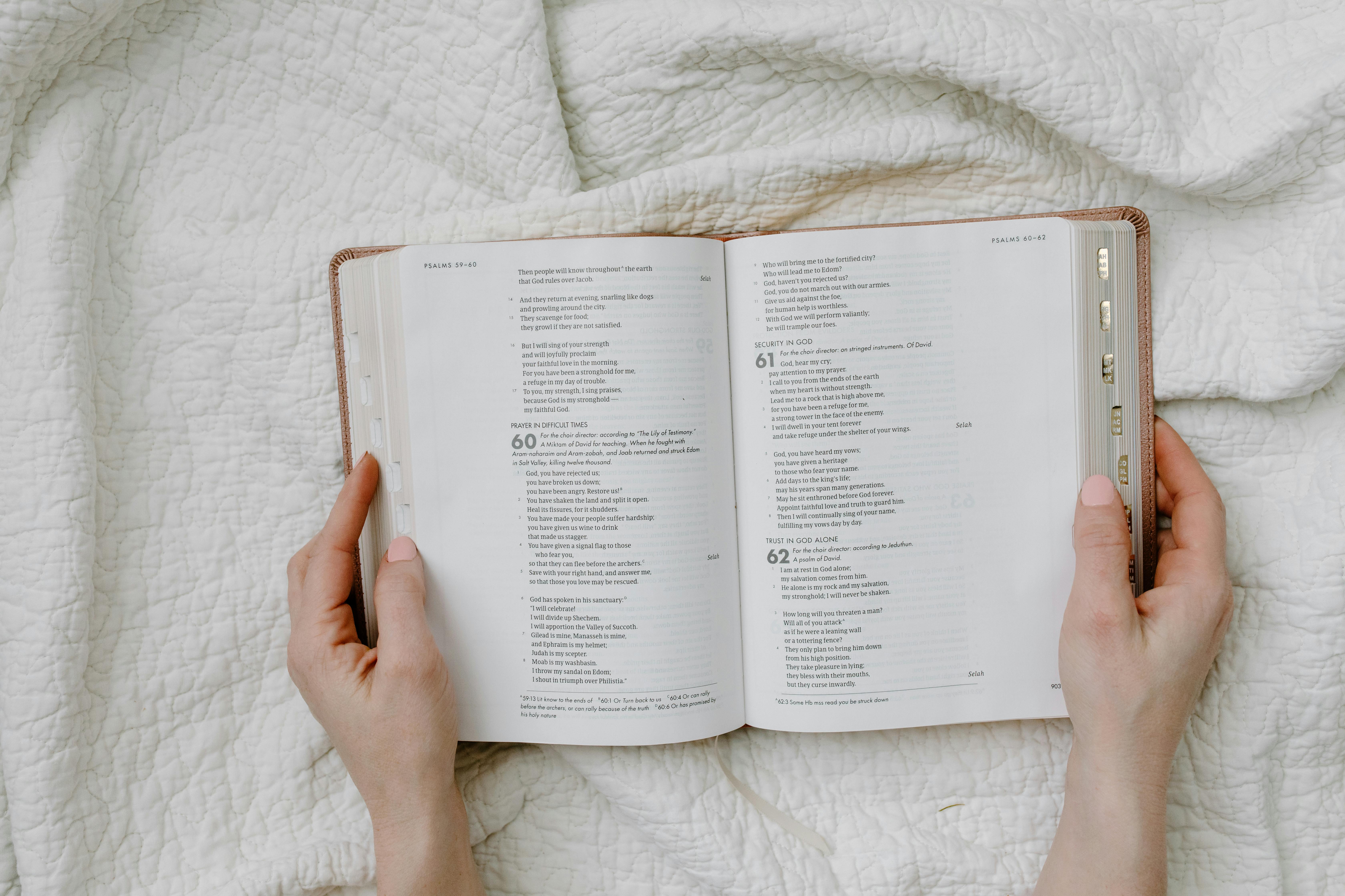 a person holding an open book