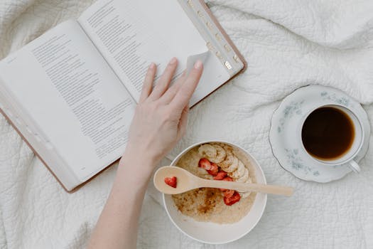 A comforting morning routine with Bible reading, oatmeal, and coffee on a cozy quilt.