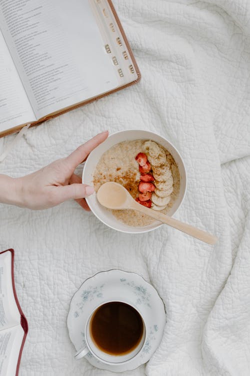 Bowl of Oatmeal Beside a Cup of Coffee