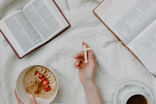 Person Holding a Cross