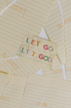 Colorful 'Let Go Let God' quote on torn yellow notepaper background.