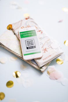 A health passport for COVID-19 displayed on a map with confetti, symbolizing safe travel planning during the pandemic.