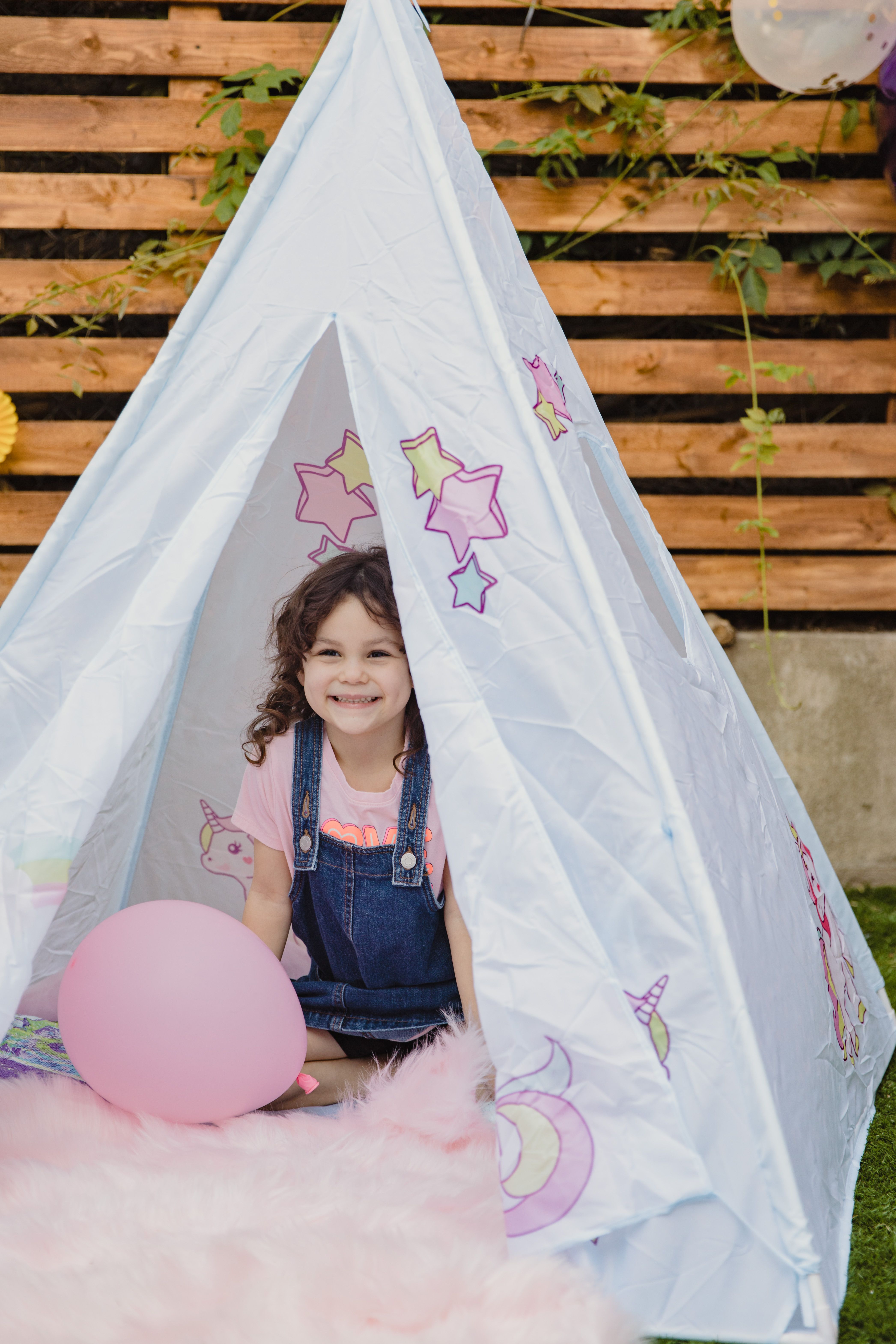 Little Girl Playing Inside a Teepee · Free Stock Photo