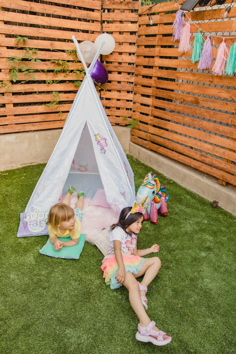 Two Girls Playing In A Teepee