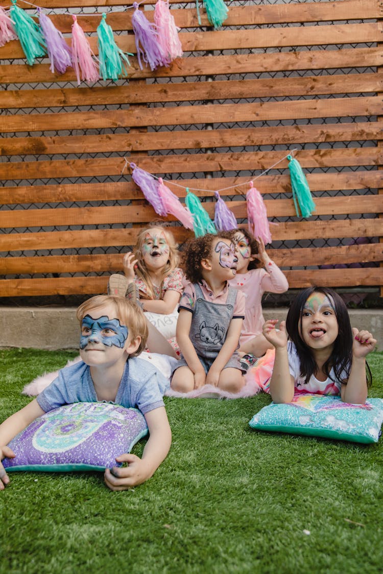 Kids Playing On Grass