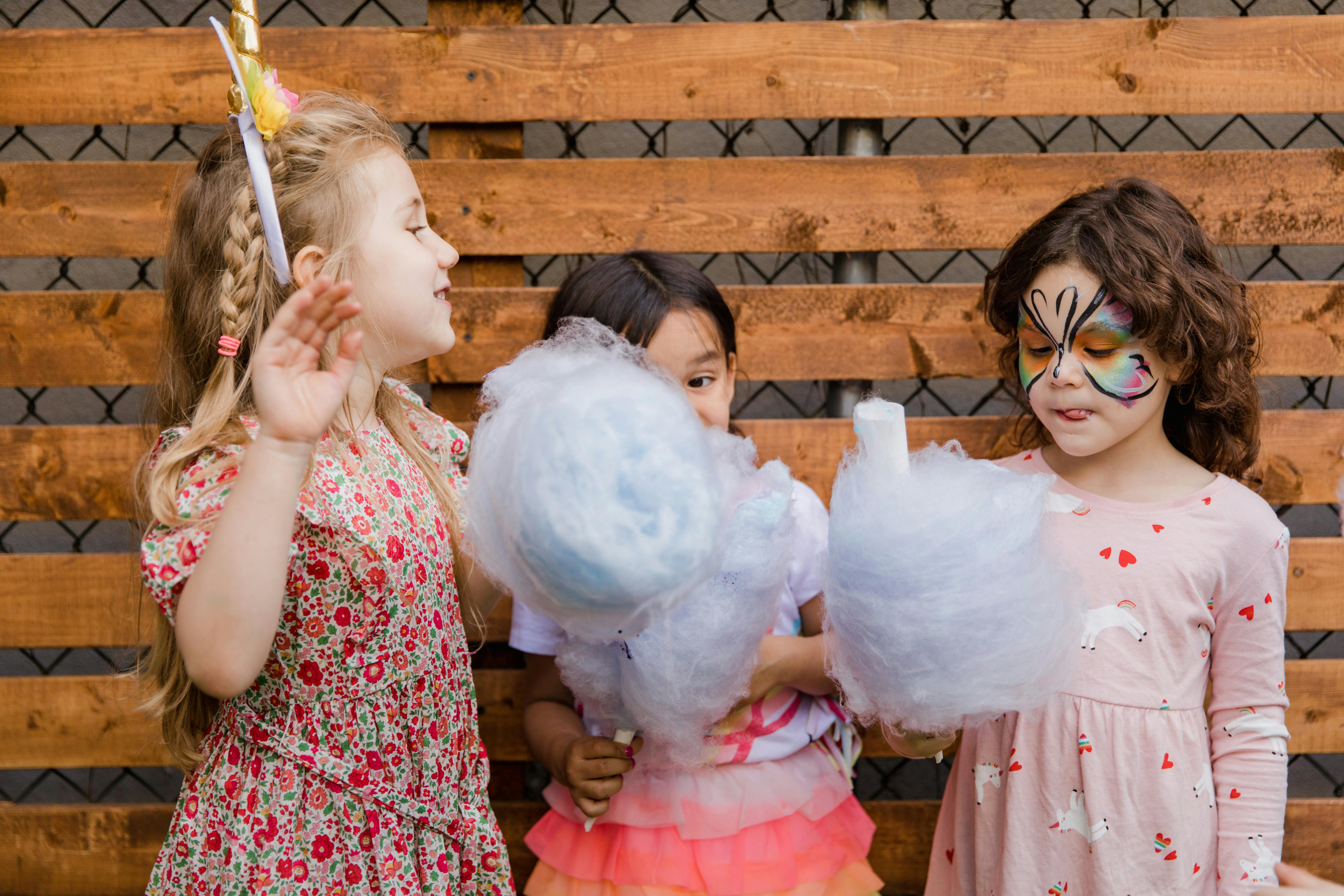 Kids Eating Cotton Candy · Free Stock Photo