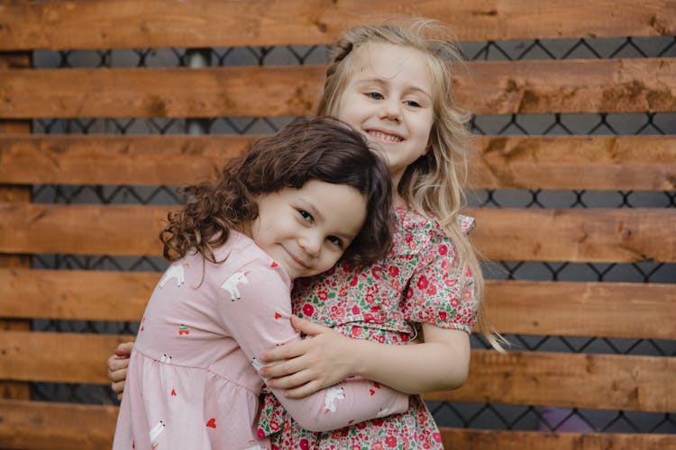 Young Girls Hugging Each Other