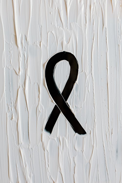 Black Ribbon - a Skin Cancer Symbol - on White Background 