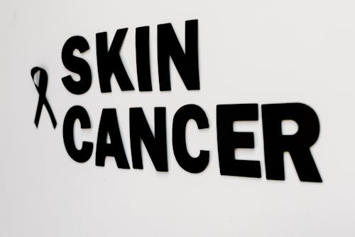 Close-up of a Black Sign Saying "Skin Cancer"
