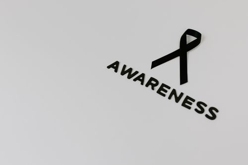 Free Minimalist image of a black ribbon symbolizing awareness against white background. Stock Photo