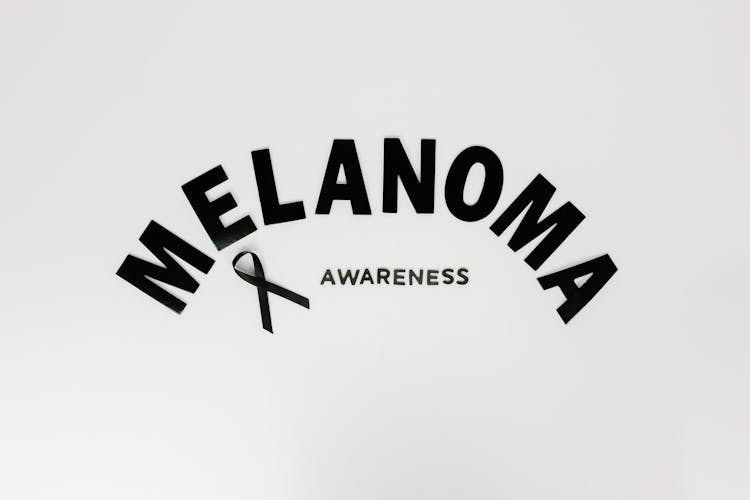 Melanoma Awareness Concept On A White Surface