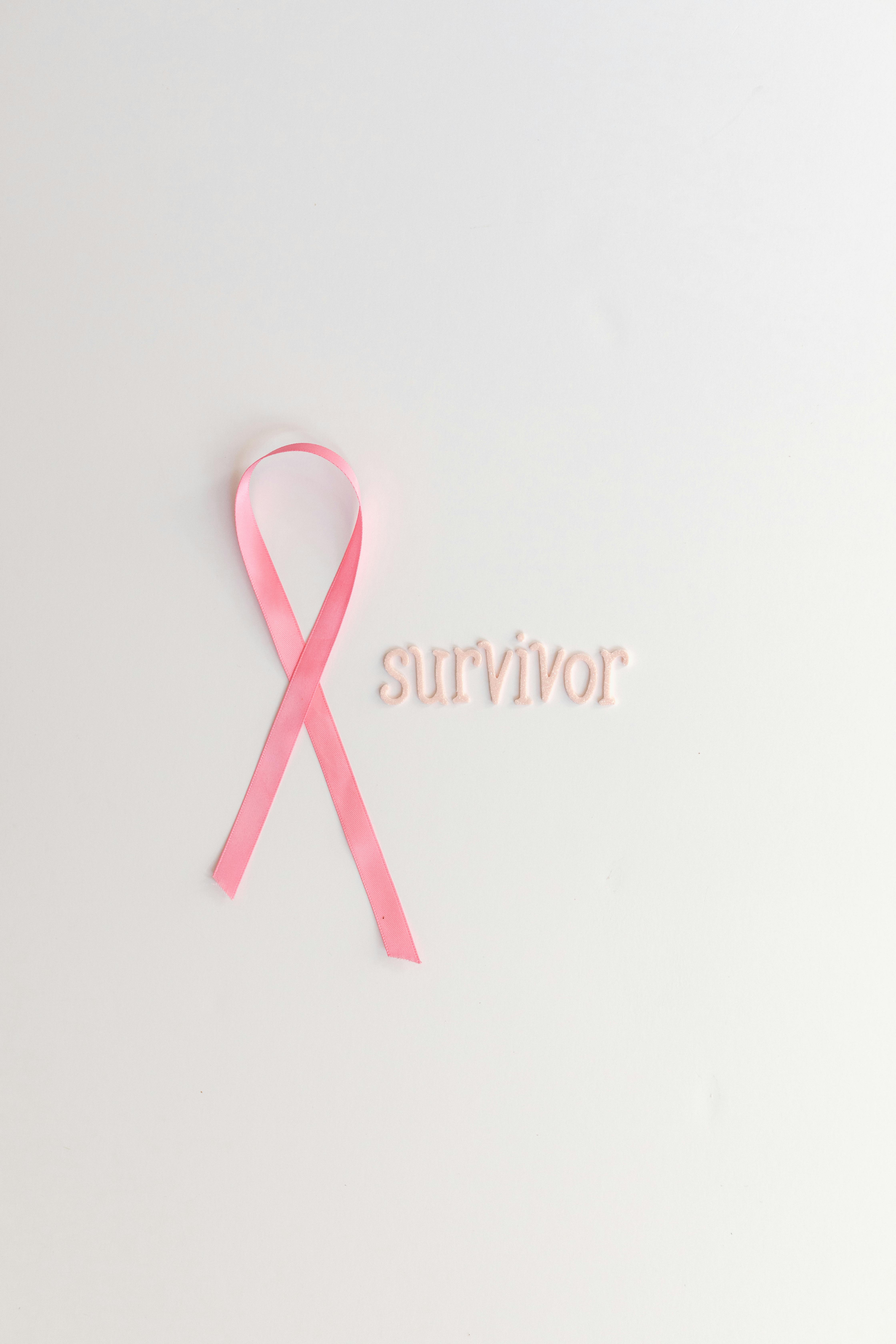 Breast cancer pink flower doodle background Vector Image