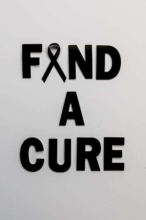 Free Black Text on White Background Saying "Find a Cure" Stock Photo