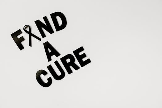 Black text 'Find A Cure' with a cancer awareness ribbon on a white background, symbolizing hope.