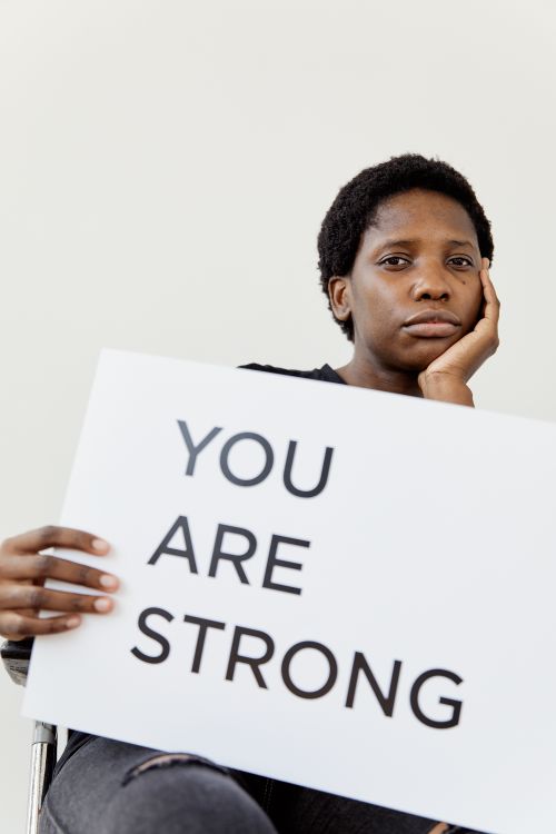 Woman Holding a Sign Saying
