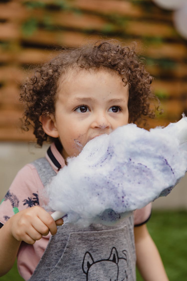 Kid Eating Cotton Candy 