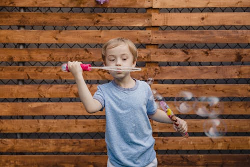Free A Boy Playing with Bubble Wand Stock Photo