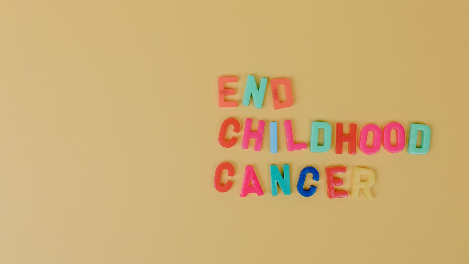 Modafinil for Cancer Related Fatigue: Unlocking Energy Vibrant multi-colored letters spell 'End Childhood Cancer' on a yellow background — modafinil for cancer related fatigue