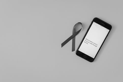 Free Mobile Phone beside a Ribbon  Stock Photo