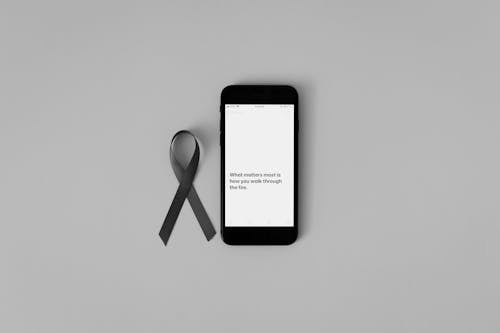 Free Mobile Phone beside a Ribbon Stock Photo