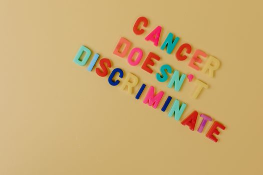 Colorful Letters on a Beige Colored Surface