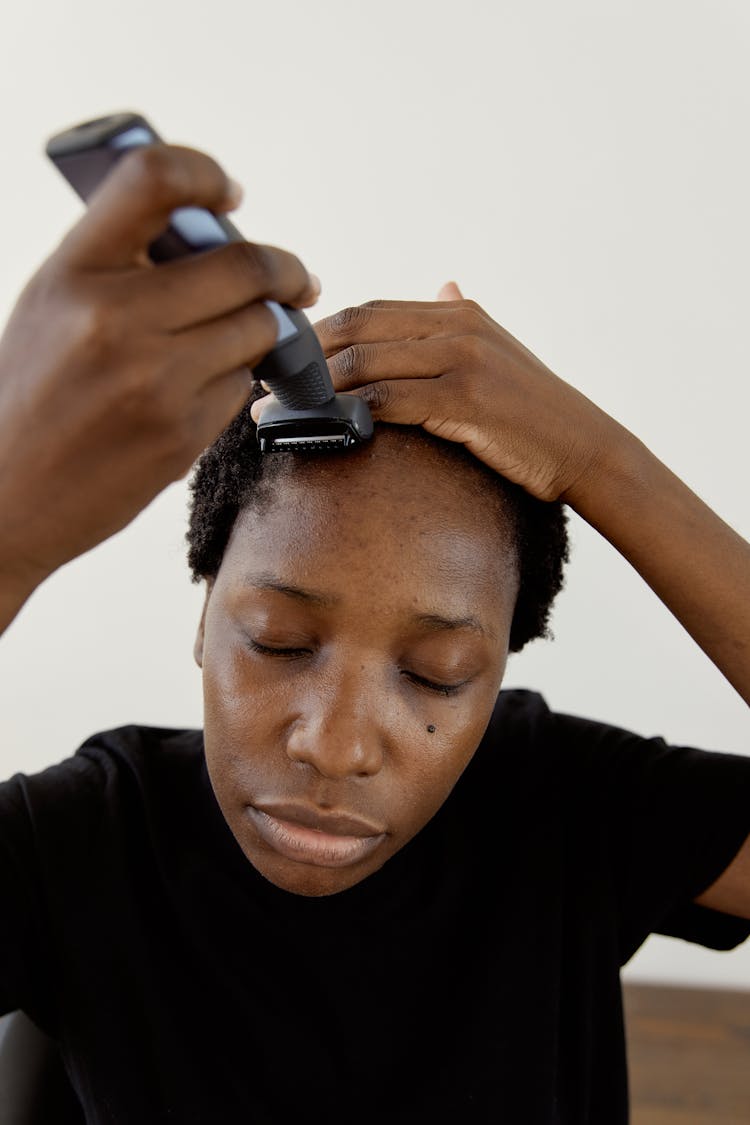 A Woman Shaving Her Hair