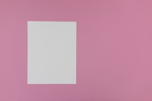 An Empty White Bond Paper on a Pink Surface