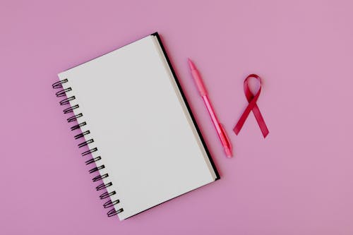 Blank Notebook on Pink Background