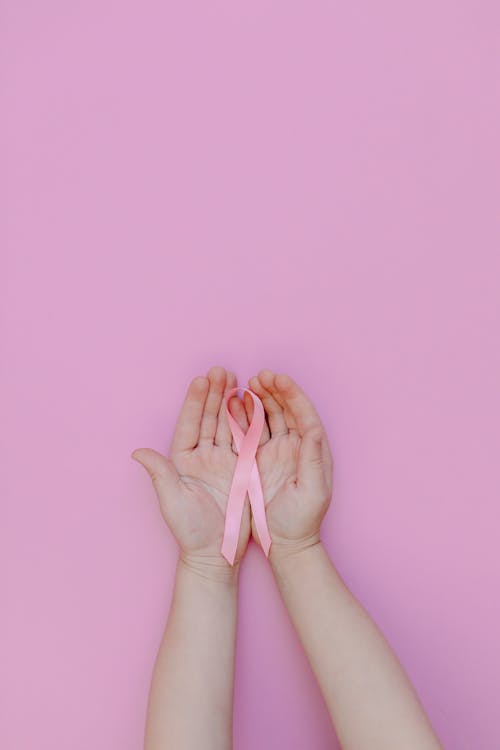 Free Person Holding Pink Ribbon Stock Photo