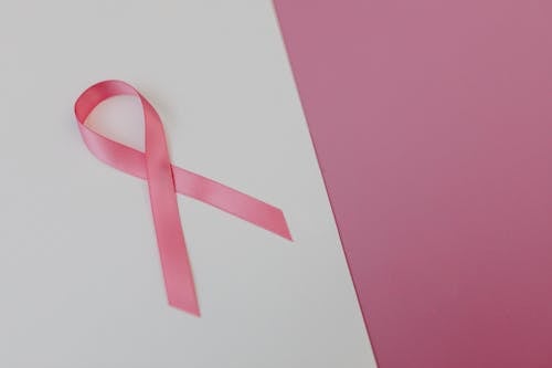 Free Photo  Close-up person with pink and white ribbon