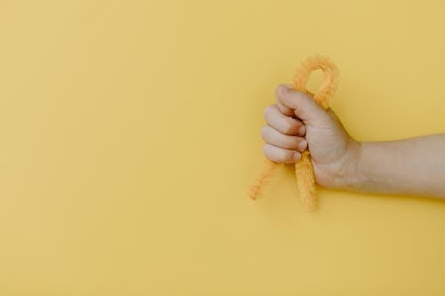 Person Holding Yellow Yarn