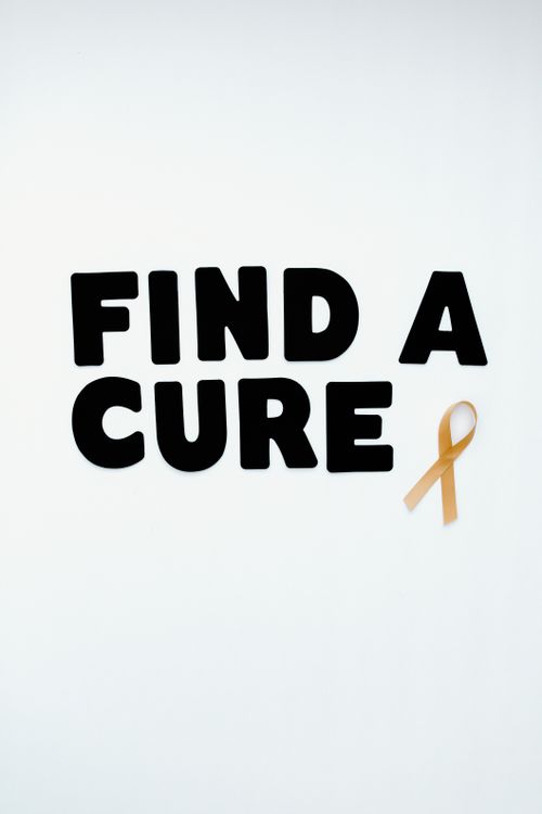 Free Inspirational image with 'Find a Cure' text and cancer awareness ribbon on white background. Stock Photo