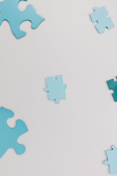 Puzzle Pieces on a White Surface 