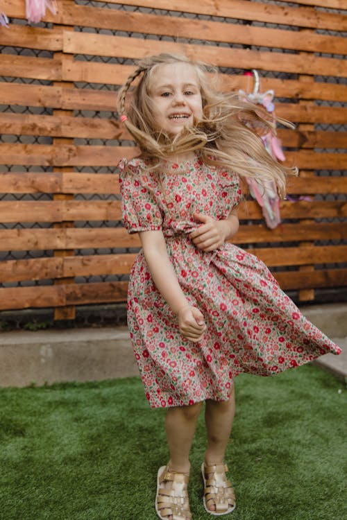 Cute Young Girl in Floral Dress