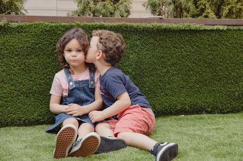 Little Boy Kissing a Little Girl