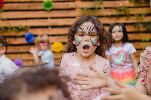 Free Cute Young Girl with Face Paint  Stock Photo