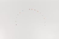 Tiny Letters on a White Surface