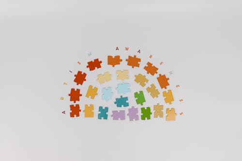 Free Puzzle Pieces on White Surface  Stock Photo
