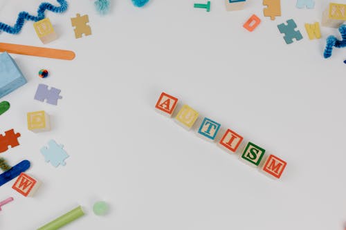 Free Colorful Letter Blocks on White Surface Stock Photo