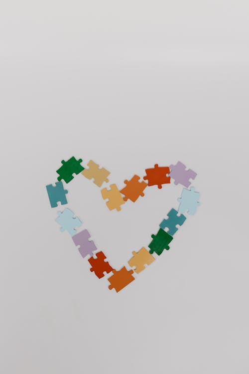 Free Colorful Puzzle Pieces in Heart Shape Stock Photo