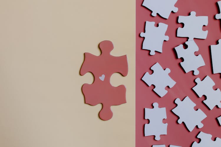 Brown Jigsaw Puzzle Piece On White Table