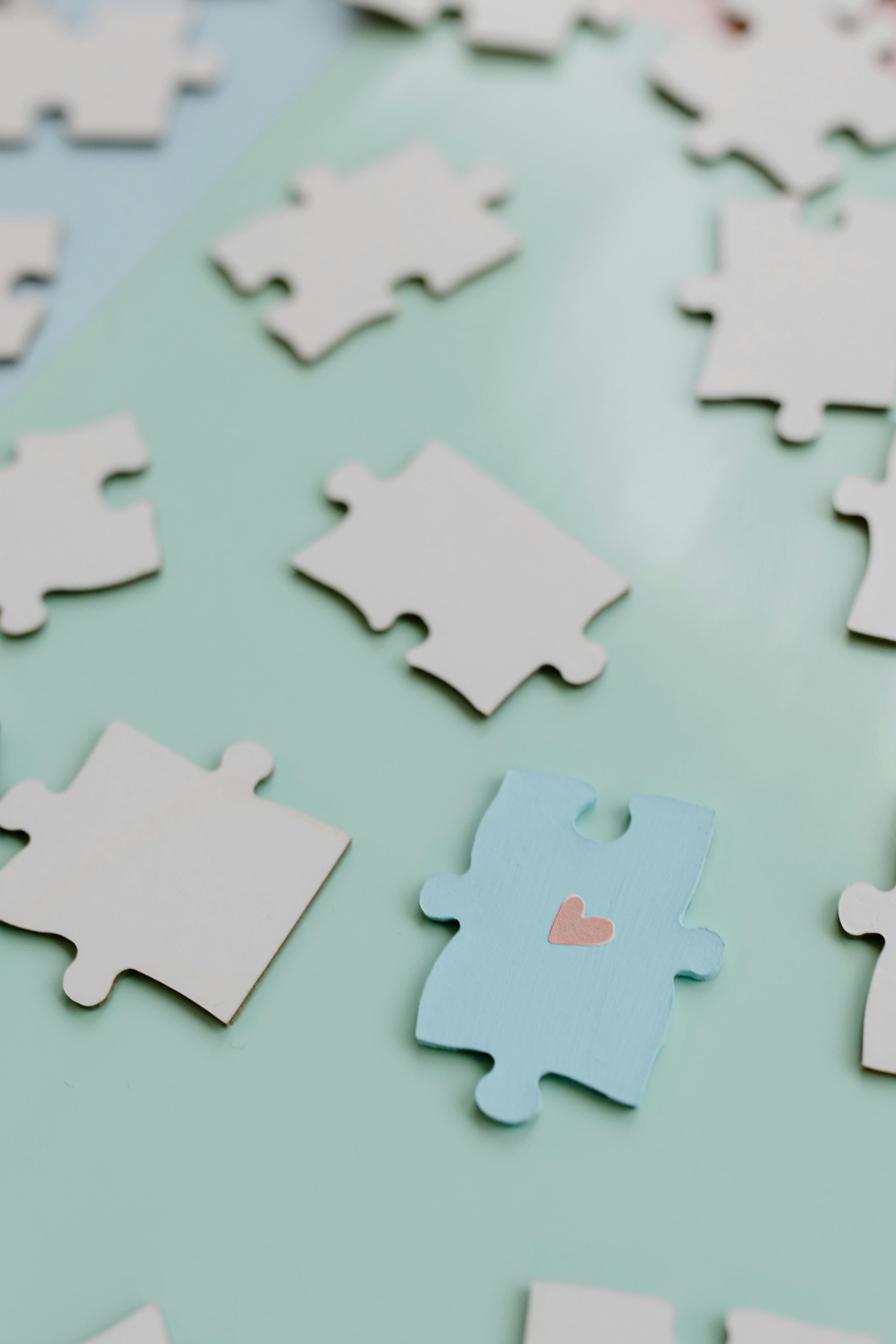 jigsaw puzzle pieces over white table